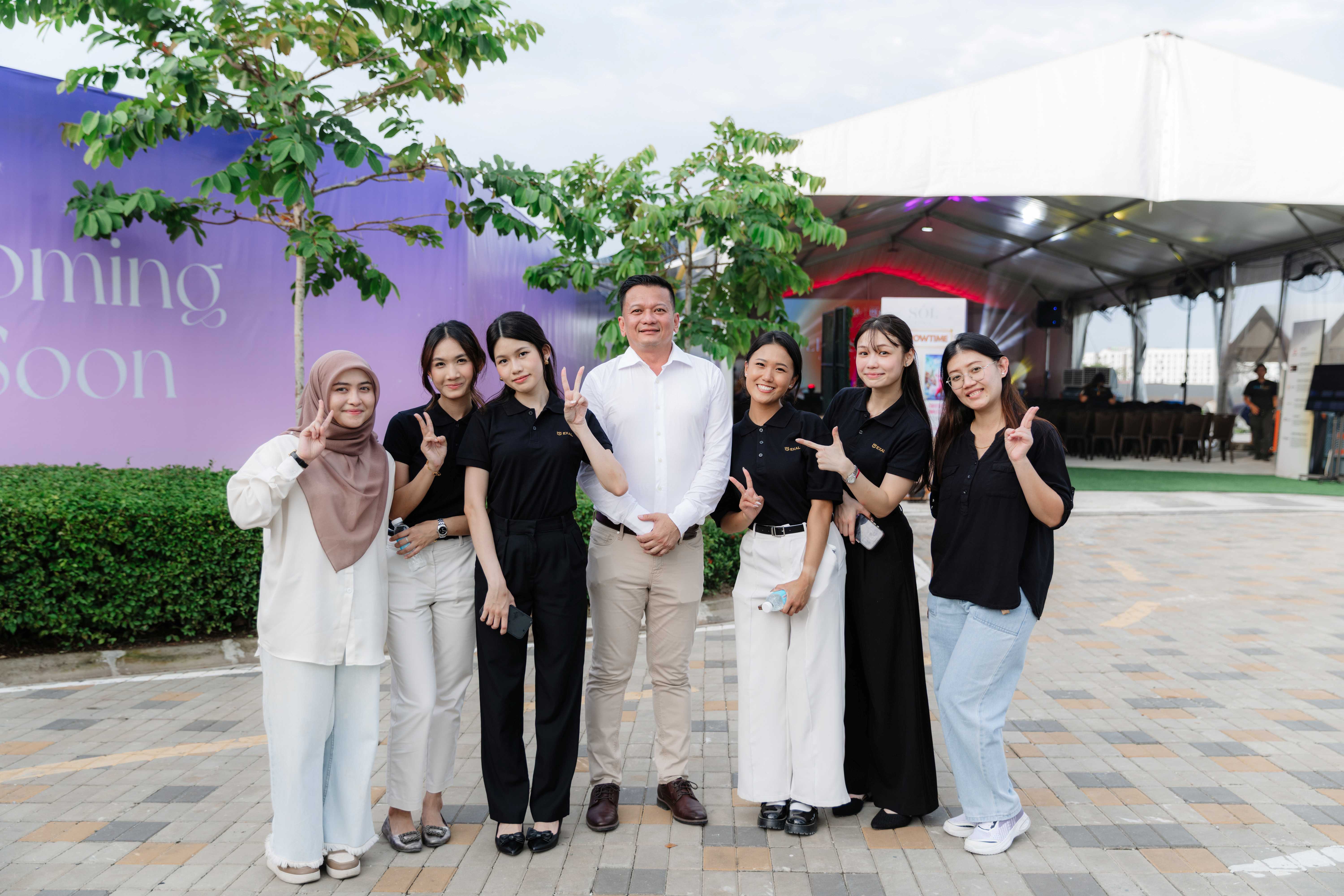 EXAL team members gathered together at an outdoor company event
