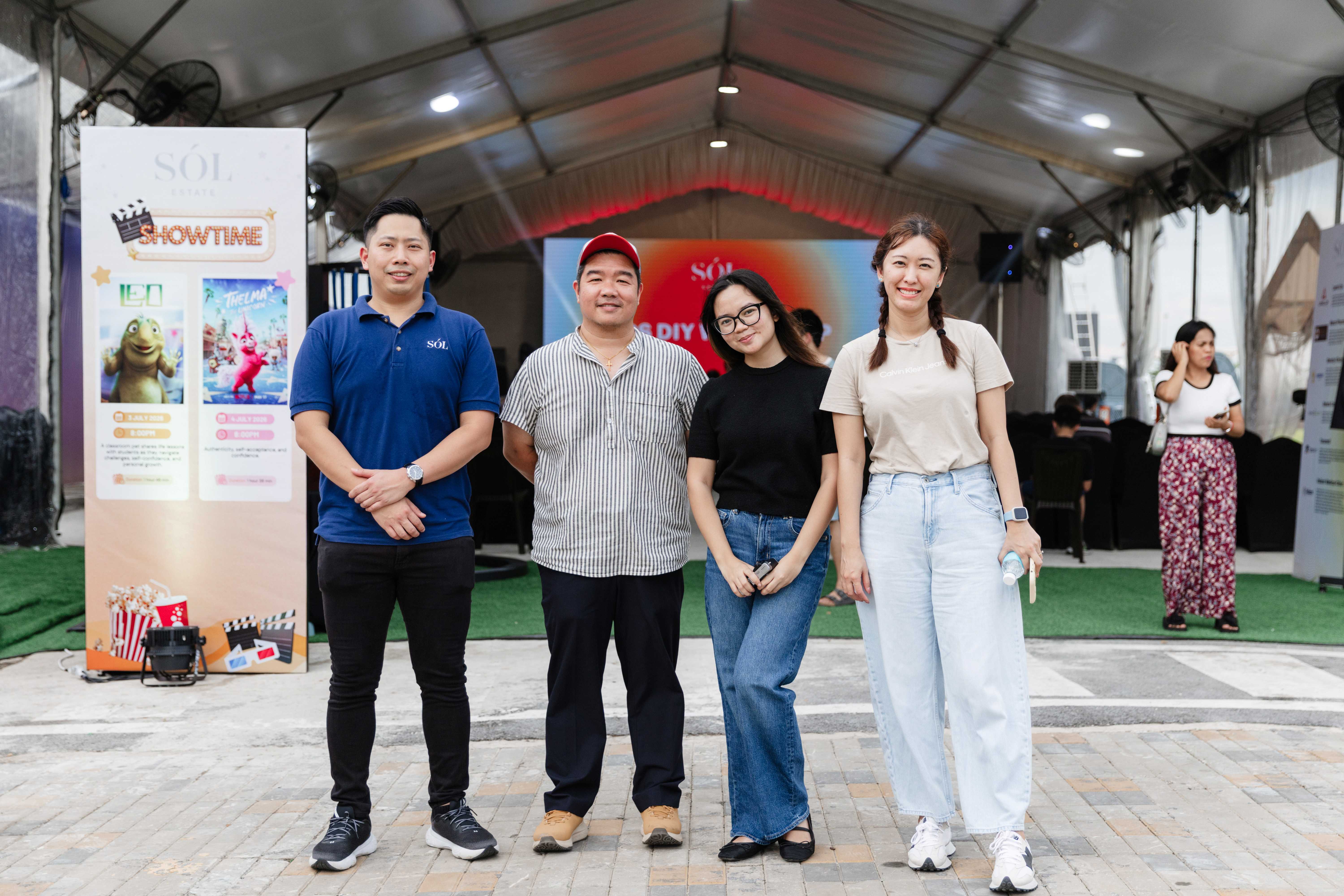 Four EXAL team members sharing a moment at an outdoor event